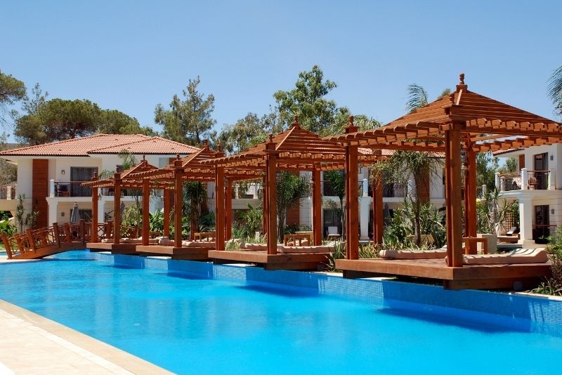 white pergola with roof