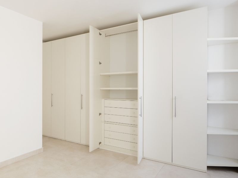 bed with fitted wardrobe